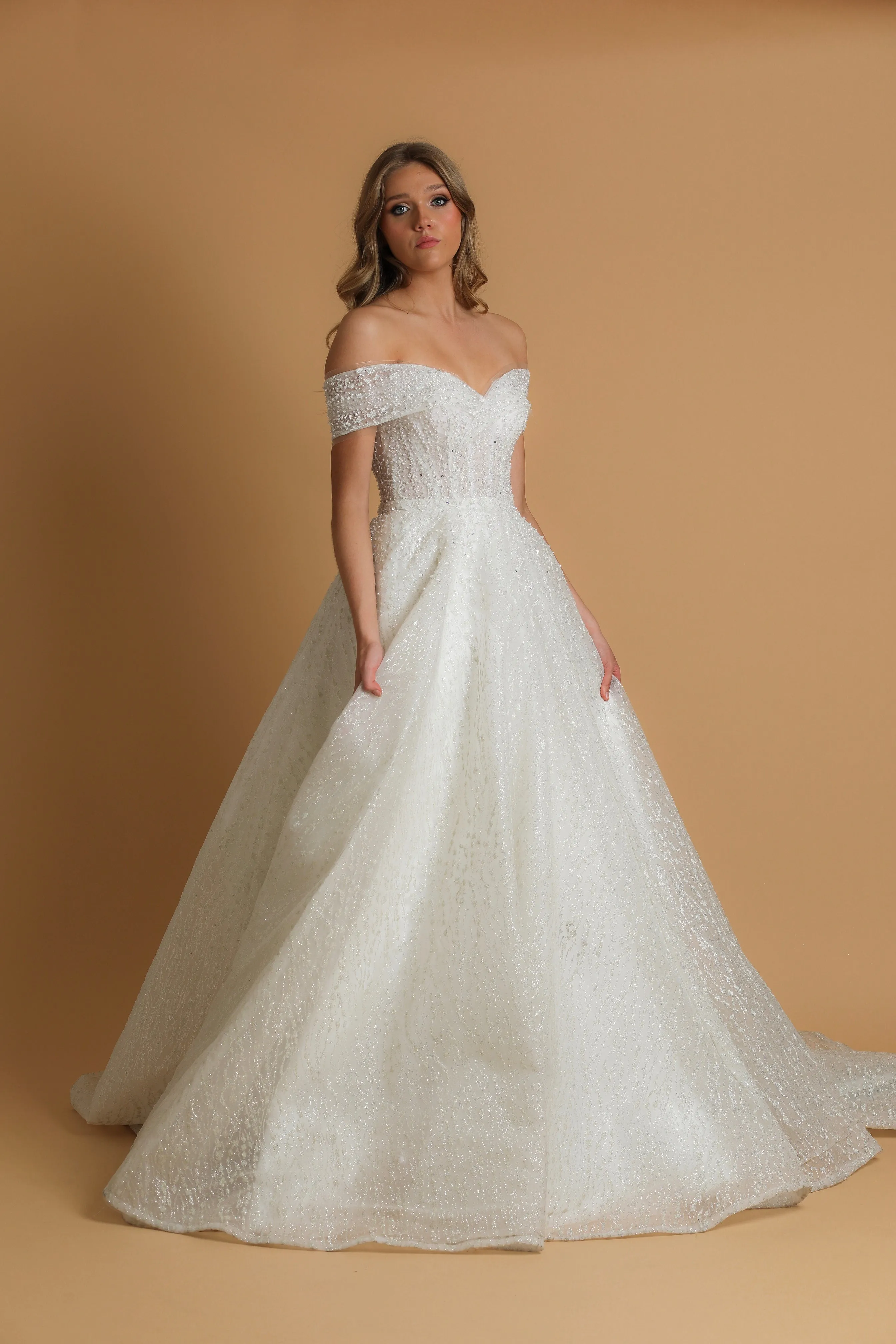 Off the shoulder ballgown wedding dress with a corset back