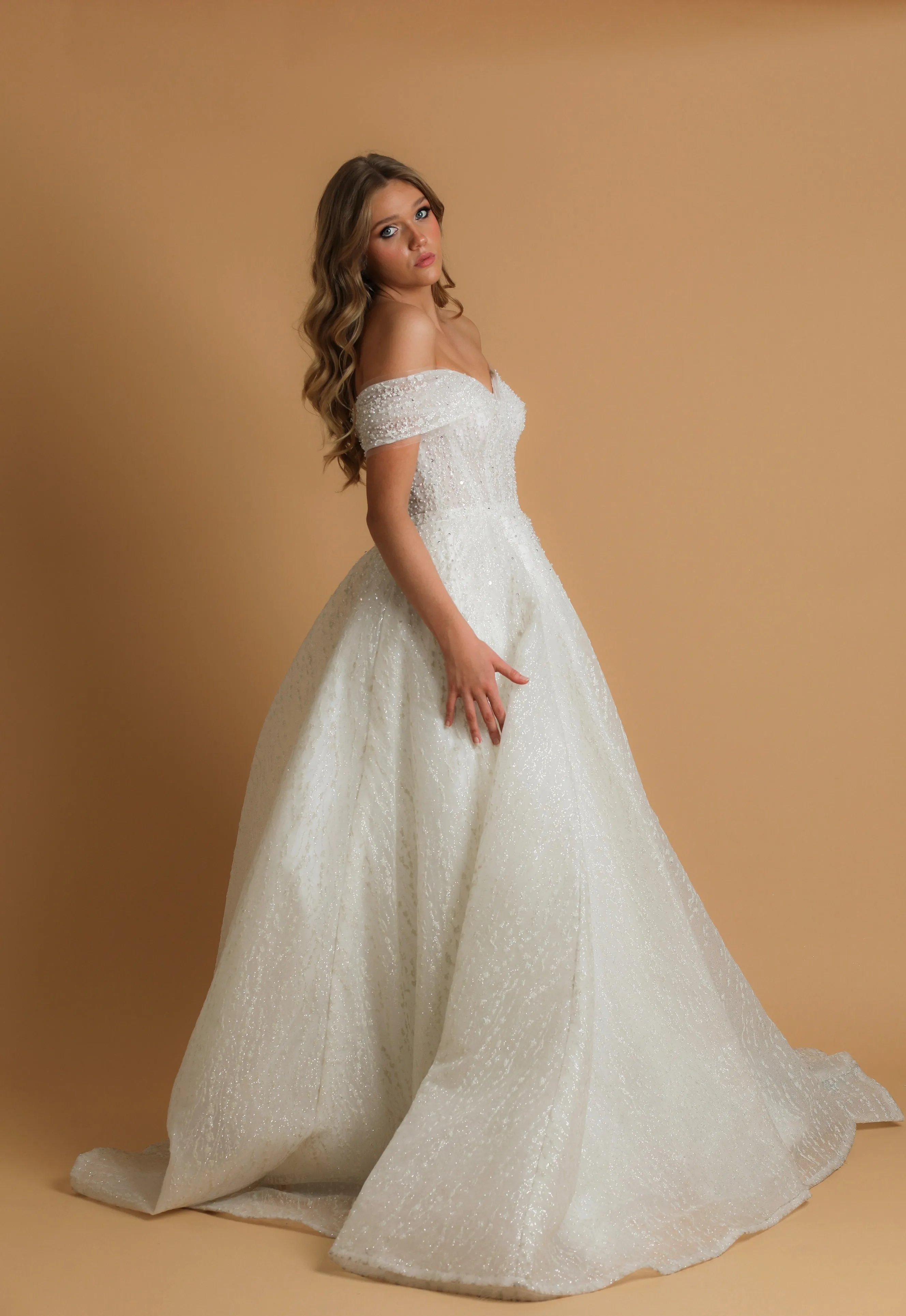 Off the shoulder ballgown wedding dress with a corset back