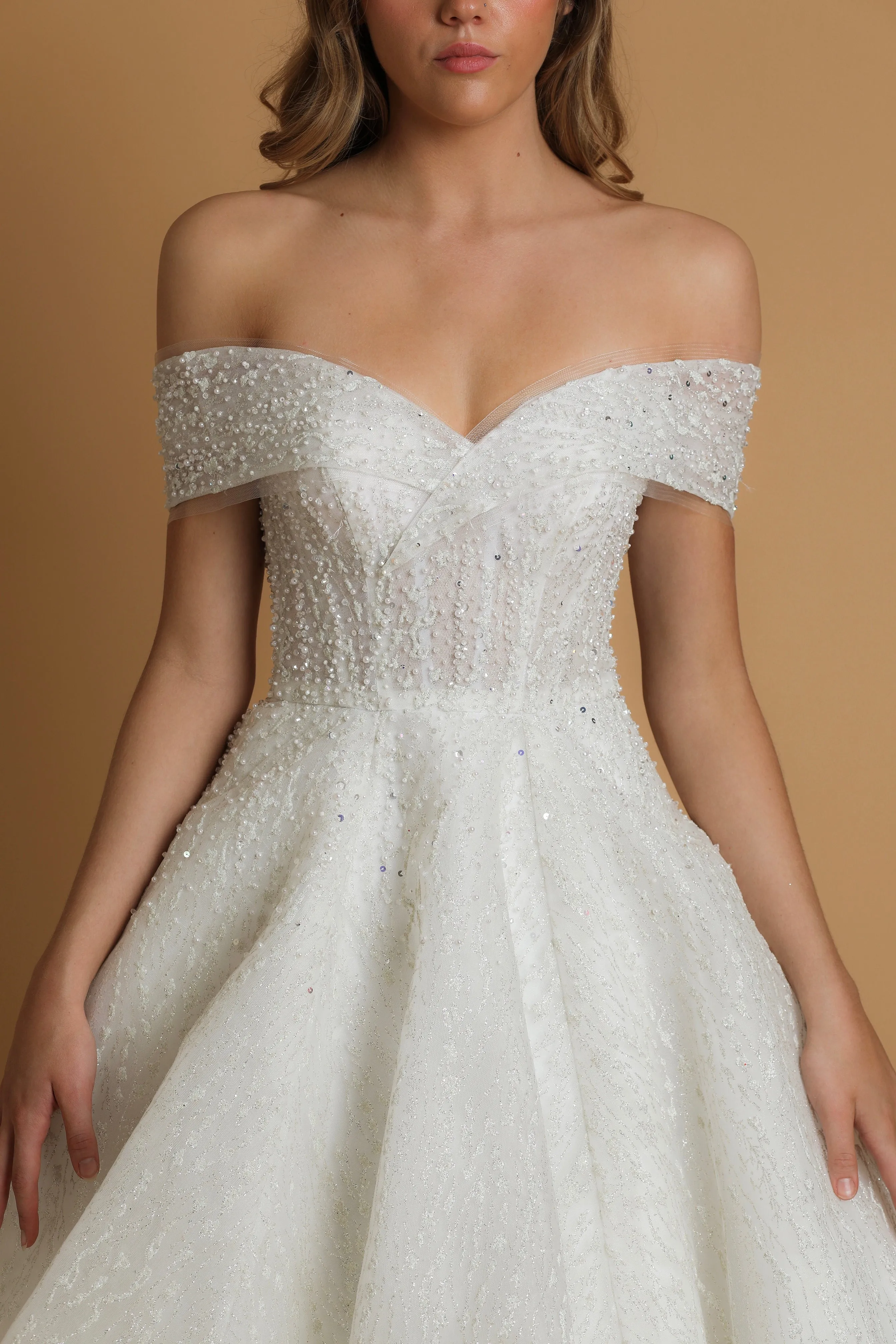 Off the shoulder ballgown wedding dress with a corset back