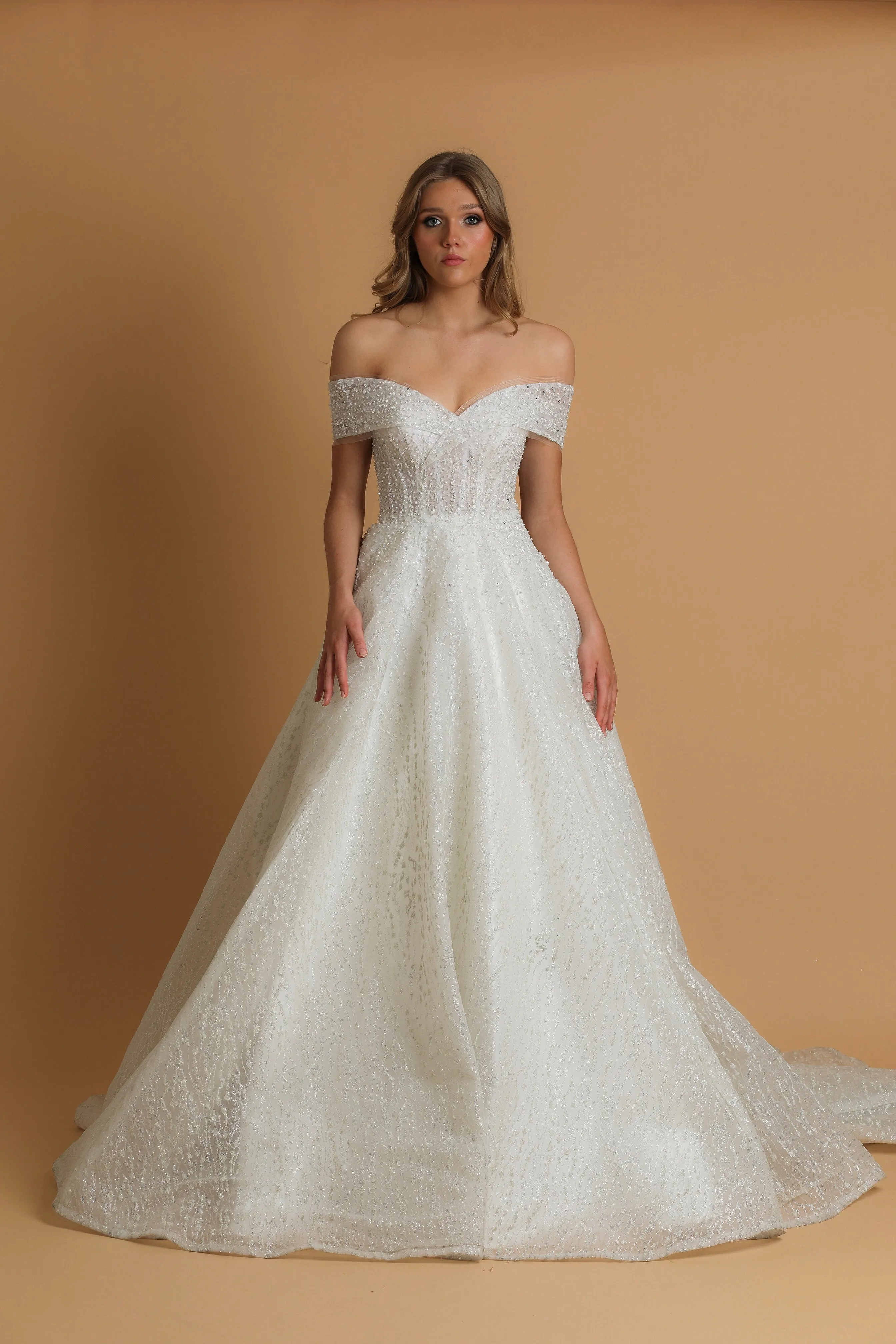 Off the shoulder ballgown wedding dress with a corset back